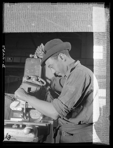 Manpower. Negro navy yard workers. America draws its manpower from all citizens alike. This navy yard machinist is one of the many skilled Negro workers now speeding ship construction in a large Eastern yard