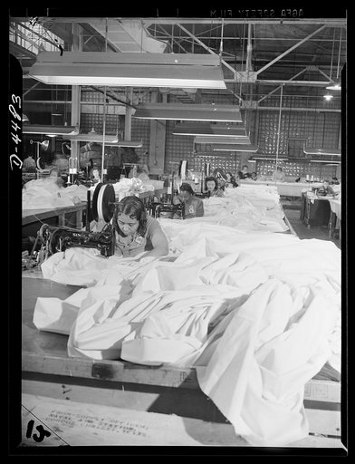 Manpower. Negro navy yard workers. So that America's paratroopers may write history in this new field of modern warfare, these women workers in the aircraft factory of an Eastern navy yard are turning miles of silk into parachutes for our armed forces