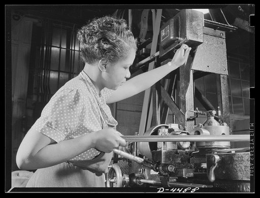 Manpower. Negro navy yard workers. American women of many racial groups are furnishing manpower for war production. This Negro girl is a machine operator in the aircraft factory of an Eastern navy yard. She is turning out small parts for assembly in another part of the plant
