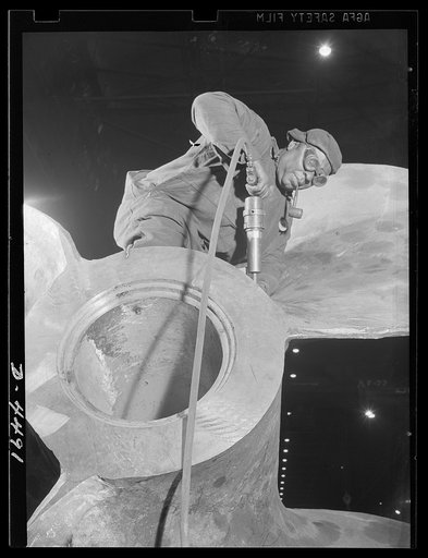 Manpower. Negro navy yard workers. Benjamin Stephens is one of the many old-timers speeding ship production in an Eastern navy yard. He operates a pneumatic chipper on the giant propellers which send American ships to all ports of the world