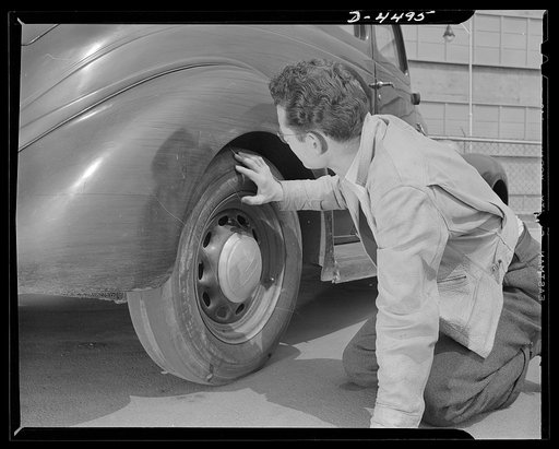 Car pooling at Lockheed Vega. Don, an aircraft worker at Lockheed Vega Aircraft Corporation, is plenty worried about the state of his tires. Continuous company publicity has convinced him that new ones will not come his way for a long, long time. Don lives about ten miles from the plant, which is th