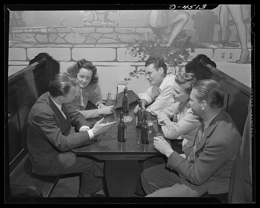 Car pooling at Lockheed Vega. After a day's work, the average rider group stops at a tavern on the way home. Most have beer. Mary sticks to Coke. All listen to Jerry telling what appears to be an interesting story