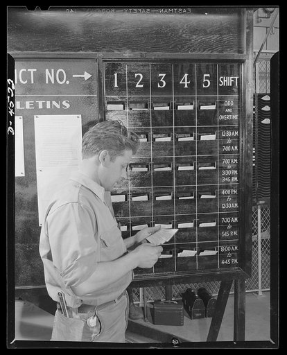Car pooling at Lockheed Vega. Slots on "ride cafeteria" board, showing arrangement by district and by shift to assist plant employees in car pooling