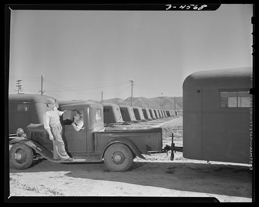 War housing. Lompoc trailer camp. A war housing trailer made by Western Trailer Company of Los Angeles is backed into place at a Lompoc, California project. The long, long lines of trailers are homes for war workers' families. Wooden horses are used to support the trailers and save tires for use on 