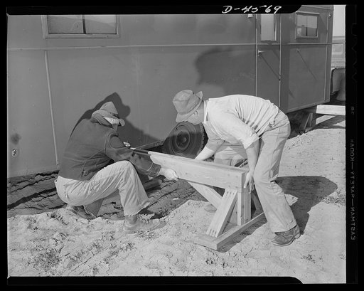 War housing. Lompoc trailer camp. A war housing trailer in place at a Lompoc, California project. Electrical, water and drainage connections have been made. Heavy wooden sawhorses are slipped under each end in line with main support of trailer floor, to permit removal of wheels and re-use of tires i