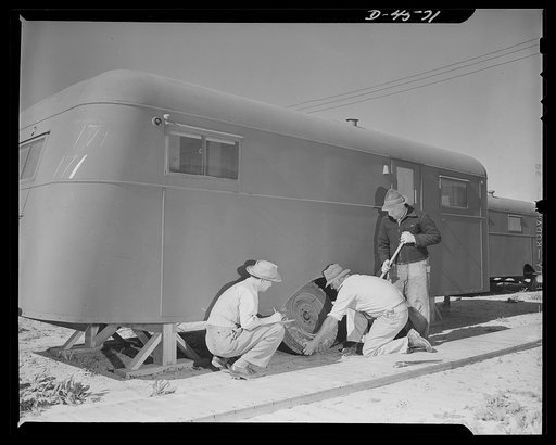 War housing. Lompoc trailer camp. A war housing trailer with wheels and tires removed is supported solidly and safely on heavy wooden horses. The number of removed tires are carefully recorded. Western Trailer Company of Los Angeles makes large numbers of these homes for war workers