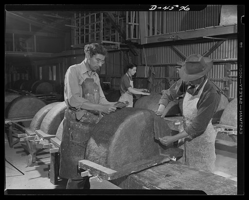 Production. War housing trailers. Paper replaces steel as material for wheel wells at the Western Trailer Company's plant in Los Angeles. Wadded-up paper, impregnated with a glue-like solution is smoothed into place over molds in continuous layers. The material is self-hardening and self-compressing