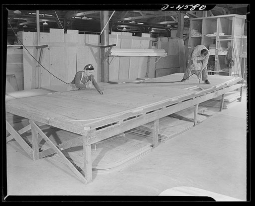 Production. War housing trailers. A war housing trailer floor made with the use of a job shapes up rapidly. Western Trailer Company of Los Angeles makes these floors particularly durable as the trailers are to be used continually in war production centers. These floors are insulated