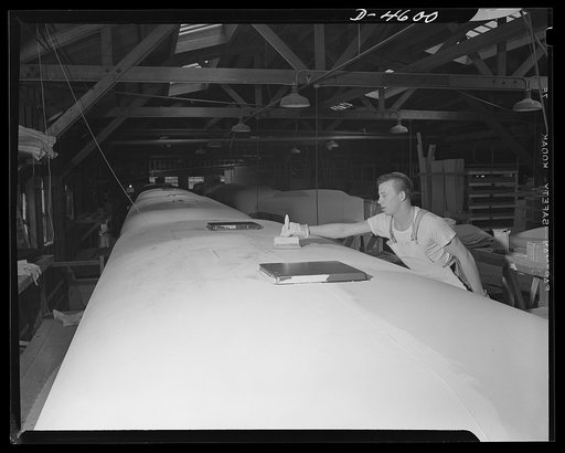 Production. War housing trailers. The top sheeting of a war housing trailer is filled with two coats of specially adapted paint at the Los Angeles plant of Western Trailer Company