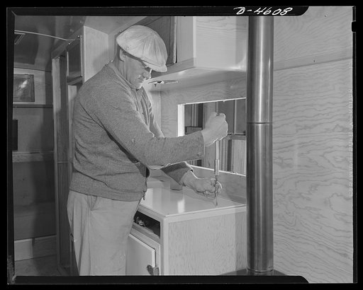 Production. War housing trailers. A sink board is secured in place as a war housing trailer takes final form in the Los Angeles plant of Western Trailer Company. Cook stove, heater, sink, icebox and beds are subcontracted items