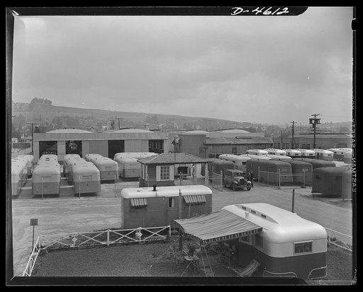 Production. War housing trailers. War housing trailer homes are made at the plant of Western Trailer Company, Los Angeles, California. One of the trailers is being cleared at the gate for delivery to a shipping point