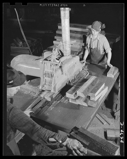 Conversion. Flooring to gunstocks. Rifle "furniture" for the Army. A ripsaw in a converted hardwood flooring plant cuts gunstock blocks of clear walnut from selected pieces which have been bandsawed from a large slab, or flitch. Louisville, Kentucky