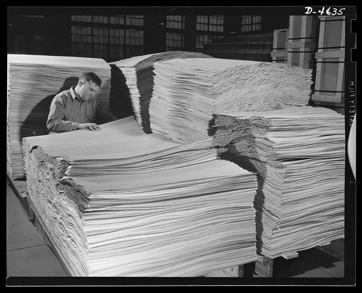 Production. Veneer for aircraft and other war essentials. Poplar veneer is inspected before being made into panels for combat planes. These rotary-cut strips are carefully checked for quality and thickness in a big Midwest veneer plant. Louisville, Kentucky