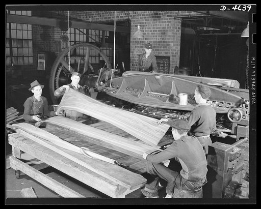 Production. Veneer for aircraft and other war essentials. Veneer for combat planes. In the "half-round method," a half log, after being heated in water to the proper temperature, is bolted on a stay log and revolved against a stationary knife. The sheets, as they fall from the knife, are stacked in 