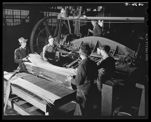 Production. Veneer for aircraft and other war essentials. Veneer for combat planes. In the "half-round method," a half log, after being heated in water to the proper temperature, is bolted on a stay log and revolved against a stationary knife. The sheets, as they fall from the knife, are stacked in 