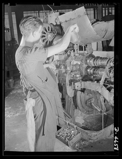 Conversion. Animal traps to armor-piercing bullet cores.  A screw-cutting machine in an Eastern animal trap factory just before it was converted from the making of machine bolts for the production of armor-piercing bullet cores