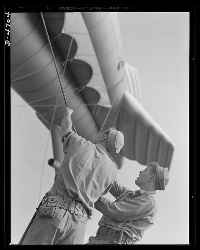 Parris Island. Marine Corps barrage balloons. A couple of husky marines and the ground tackle of a barrage balloon don't take long getting acquainted. Special Marine Corps units in training at Parris Island, South Carolina add balloon barrage technique to their large repertoire of fighting methods