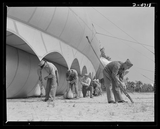 Parris Island. Marine Corps barrage balloons. Bedding down a big barrage balloon is just another job that the leathernecks take in stride as special marine units are trained at Parris Island, South Carolina. "Purging" it with fresh gas before it goes aloft again and running it up into a tactical for