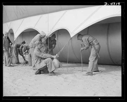 Parris Island. Marine Corps barrage balloons. Bedding down a big barrage balloon is just another job that the leathernecks take in stride as special marine units are trained at Parris Island, South Carolina. "Purging" it with fresh gas before it goes aloft again and running it up into a tactical for