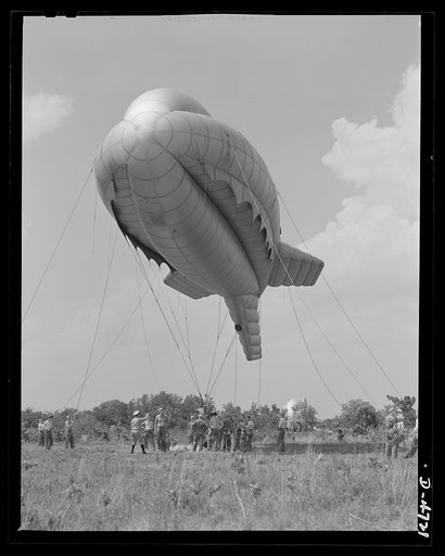 Parris Island. Marine Corps barrage balloons. Up she goes. A barrage balloon takes to the air under the capable handling of a Marine Corps ground crew at Parris Island, South Carolina. Special marine units assigned to the work have made the balloon barrage an effective method of preventing enemy air