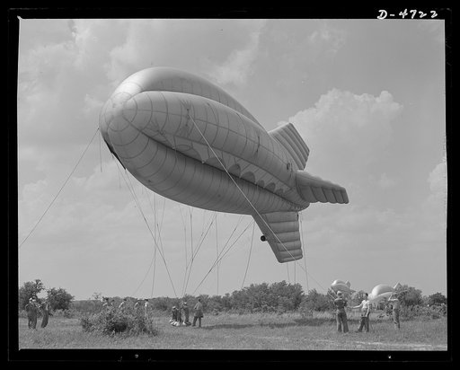 Parris Island. Marine Corps barrage balloons. Up she goes. A barrage balloon takes to the air under the capable handling of a Marine Corps ground crew at Parris Island, South Carolina. Special marine units assigned to the work have made the balloon barrage an effective method of preventing enemy air