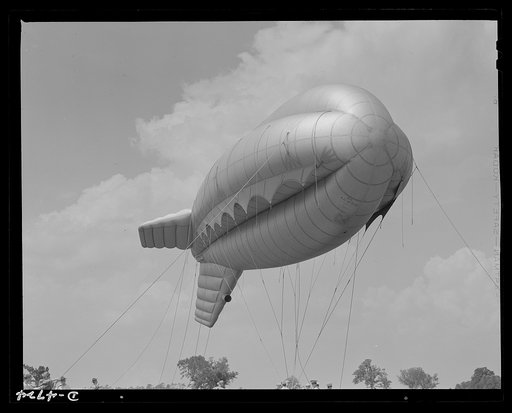 Parris Island. Marine Corps barrage balloons. Up she goes. A barrage balloon takes to the air under the capable handling of a Marine Corps ground crew at Parris Island, South Carolina. Special marine units assigned to the work have made the balloon barrage an effective method of preventing enemy air