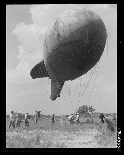 Parris Island. Marine Corps barrage balloons. Up she goes. A barrage balloon takes to the air under the capable handling of a Marine Corps ground crew at Parris Island, South Carolina. Special marine units assigned to the work have made the balloon barrage an effective method of preventing enemy air