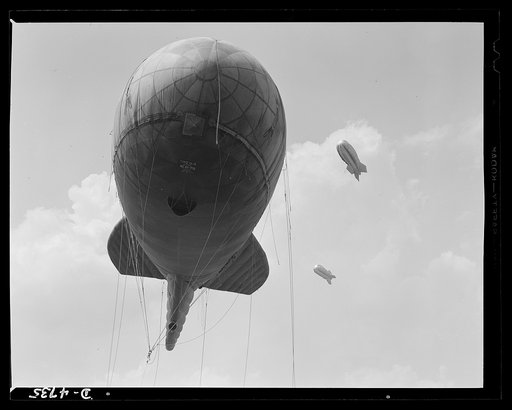 Parris Island. Marine Corps barrage balloons. Another stopper for the Axis. Sections of a marine balloon barrage over Paris Island, South Carolina. The swaying balloons with their trailing cables and steel winch lines make dive bombing and ground strafing of important locations too costly in planes 