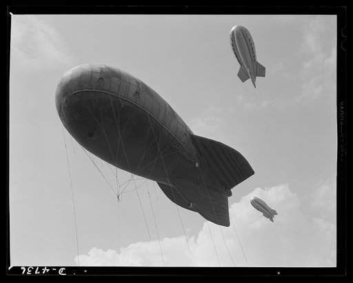 Parris Island. Marine Corps barrage balloons. Another stopper for the Axis. Sections of a marine balloon barrage over Paris Island, South Carolina. The swaying balloons with their trailing cables and steel winch lines make dive bombing and ground strafing of important locations too costly in planes 
