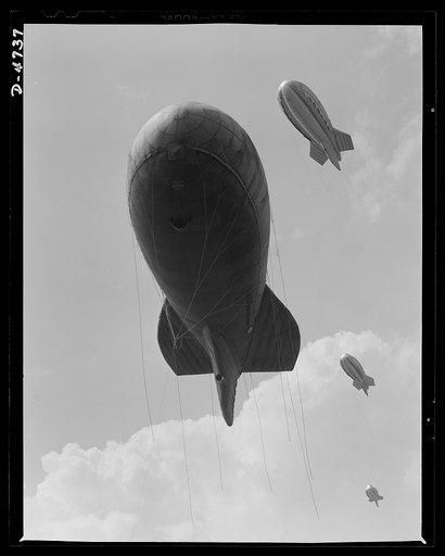 Parris Island. Marine Corps barrage balloons. Another stopper for the Axis. Sections of a marine balloon barrage over Paris Island, South Carolina. The swaying balloons with their trailing cables and steel winch lines make dive bombing and ground strafing of important locations too costly in planes 
