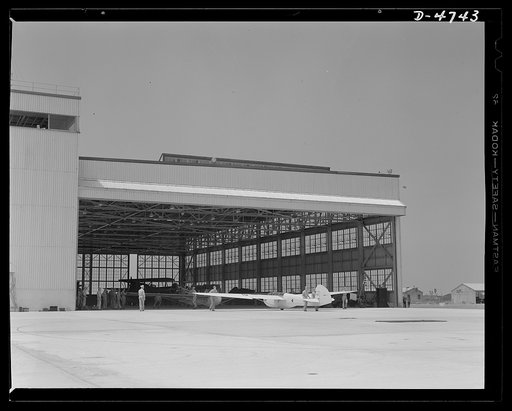 Parris Island. Marine Corps gliders. A new war tool for the leathernecks. A glider plane leaves a hanger at Page Field, Parris Island, South Carolina where the Marine Corps is teaching its young gyrene pilots how to get the motorless planes into the air, keep them up a long time, take them over a co