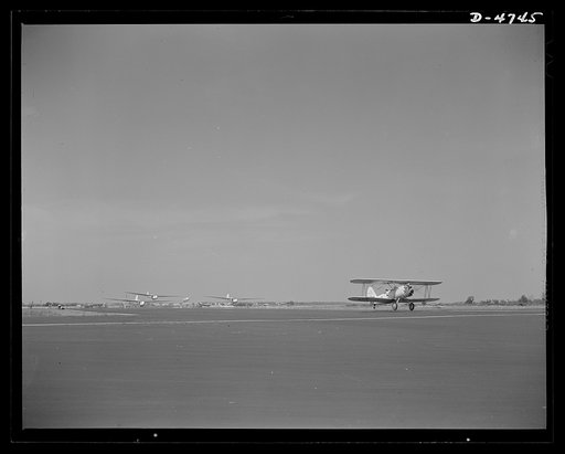 Parris Island. Marine Corps gliders. At sunbaked Page Field, Parris Island, South Carolina, the Marine Corps is doing a great job of training glider pilots. A tow plane and three gliders with student pilots return to earth after successful flights