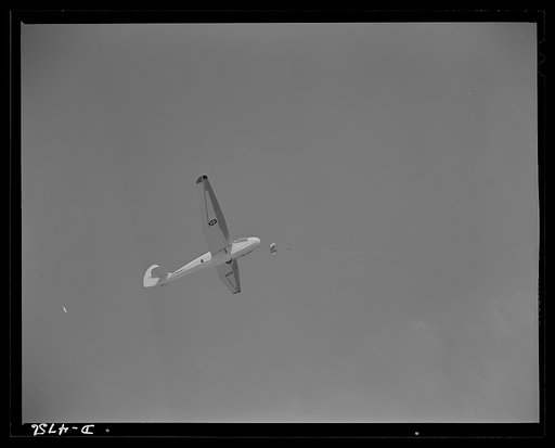 Parris Island. Marine Corps gliders. A Marine Corps glider towed by a power plane at Page Field, Parris Island, South Carolina. The student glider pilot may some day make a visit, in battle dress, on Adolph, Benito or Hiro