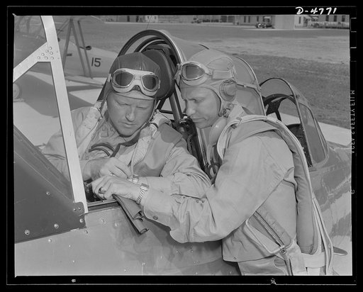 Parris Island. Marine Corps gliders. They fly without engines. Lieutenants of the Marine Corps, studying glider pilotage, compare notes before a flight