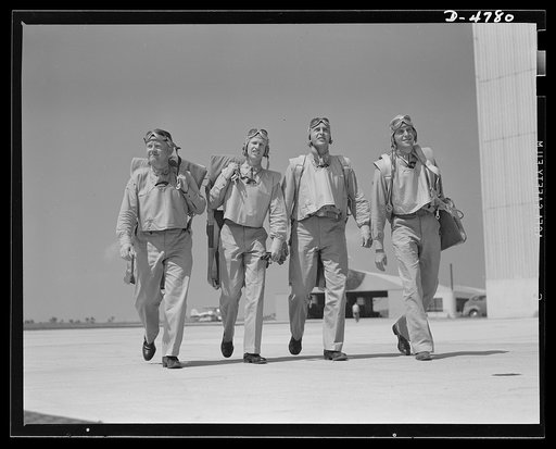 Parris Island. Marine Corps gliders. Look out for these boys, Adolph. Some day these lieutenants of the Marine Corps may land in battle dress at Berchtesgarden. Now they're learning how to pilot gliders at Page Field, Parris Island, South Carolina