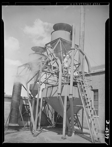 Production. Industrial alcohol. The "cyclone" of a former whiskey distillery now producing alcohol for war purposes whirls a grain mash from which alcohol has been distilled to remove moisture. The partially dried mash is then loaded on railway cars for farm use