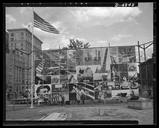 Four Freedoms and Arsenal of Democracy posters. All set but for the overhead lighting. This 15 x 30 foot panel and a second of life size entitled the Four Freedoms were displayed in Defense Square, Washington for a month beginning November 7, 1941. The panels, entitled The Four Freedoms and Arsenal 