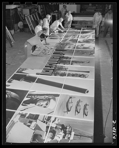 Four Freedoms and Arsenal of Democracy posters. The Arsenal of Democracy panel at the National and Civilian Defense Exposition is readied by workmen. Only half the panel is shown here. This and a montage representing the Four Freedoms were designed by Jean Carlu, eminent psoter artist. Each measures