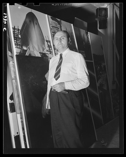 On hand for the launching of the two giant photomontages is the eminent poster artist Jean Carlu. Tha panels, entitled Arsenal of Democracy and the Four Freedoms, measure 15 x 30 feet each and were designed for the Office of Emergency Management (OEM). Both are now on display at the National and Civ