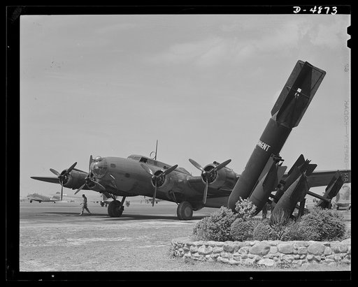 Langley Field, Virginia. YB-17 bombardment squadron. One of America's new warships of the air, a mighty YB-17 bomber, is pulled up at a bombardment squadron hanger at Langley Field, Virginia. It is all set to taxi out to a runway and take off