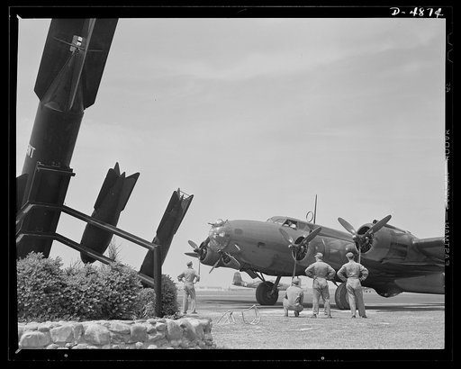 Langley Field, Virginia. YB-17 bombardment squadron. One of America's new warships of the air, a mighty YB-17 bomber, is pulled up at a bombardment squadron hanger at Langley Field, Virginia. It is all set to taxi out to a runway and take off