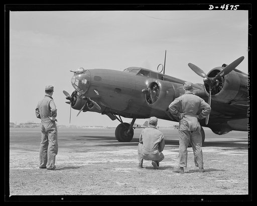 Langley Field, Virginia. YB-17 bombardment squadron. Every note from the power plants of the big planes has a meaning for the men of this bombardment squadron. A maintenance crew listens alertly while the pilot of a mighty YB-17 bomber warms up the first of his four powerful engines for a takeoff fr