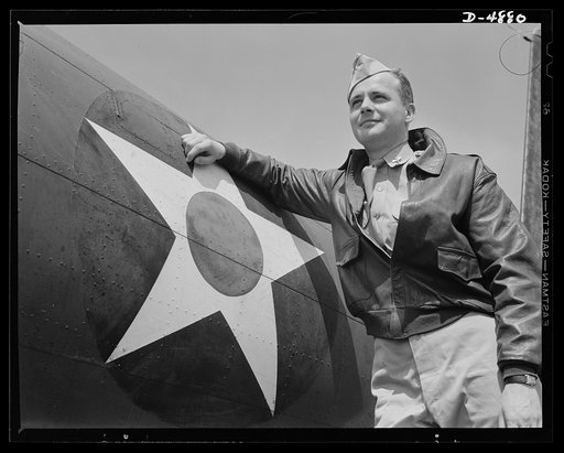 Langley Field, Virginia. YB-17 bombardment squadron. The kind of man Hitler wishes we didn't have. A bomber pilot, captain in a bombardment squadron stationed at Langley Field, Virginia, just before he climbs aboard his huge YB-17 bombing plane