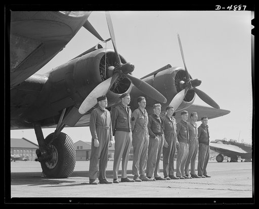 Langley Field, Virginia. YB-17 bombardment squadrons. A combat crew of one of our mighty YB-17 bombers lines up before a warship of the skies. A captain and lieutenant act as pilot and co-pilot. Two sergeants and four corporals man the machine guns, radio and other equipment. All belong to a bombard