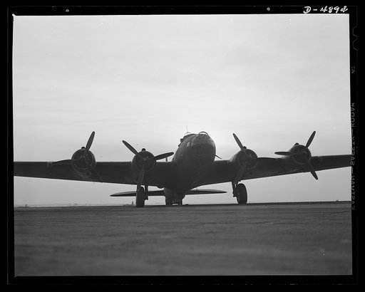 Langley Field, Virginia. The massiveness of a YB-17 bomber is well shown by this hands-on view of the giant plane, which has just completed a military mission and is waiting to be rolled to its hanger at Langley Field, Virginia