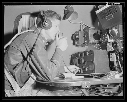 Langley Field, Virginia. YB-17 bombardment squadron. A staff sergeant of a bombardment squadron serves as radio operator on a huge YB-17 bomber. He is reporting to his home base at Langley Field, Virginia