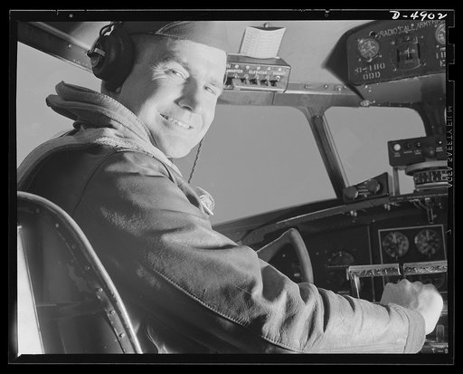 Langley Field, Virginia. YB-17 bombardment squadron. When it comes to getting action out of a big bomber, he has what it takes. A captain of a bombardment squadron stationed at Langley Field, Virginia is at the controls of the mighty YB-17 bomber he pilots