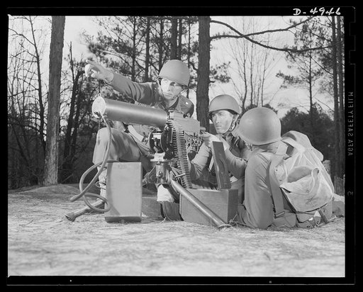 Fort Benning machine gunners. These boys have learned some tricks to show the Axis. This machine gun crew is finishing a sharpening-up course at Fort Benning, Georgia