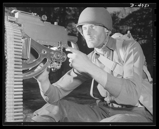 Fort Benning machine gunners. He'll soon be an unpopular figure in Berlin and Tokyo circles. An American machine gunner finishing an intensive training course at Fort Benning, Georgia