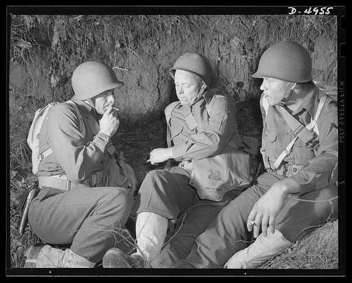Fort Benning machine gunners. Members of an American machine gun crew rest up between periods of intensive activity which is part of their their training course at Fort Benning, Georgia